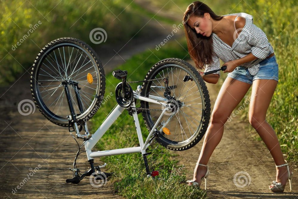 sexy-biker-bicycle-has-flat-tyre-woman-pump-up-31725190.jpg