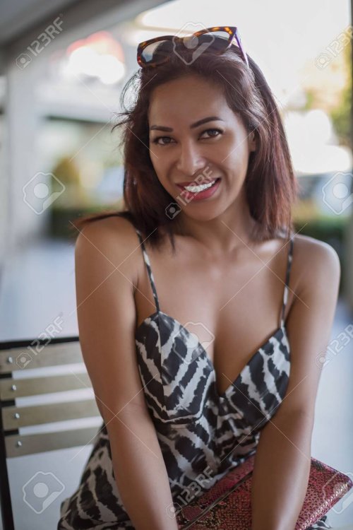 121836113-philippines-ladyboy-with-deep-cleavage-cleavage-smiling-and-looking-at-the-camera-having-a-hairstyle.jpg